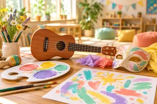 Imagine ilustrativă: Culori, pensule, instrument muzical și mască de teatru